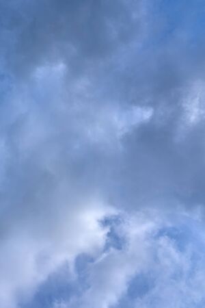Cloudy sky with a parts of clear blue sky. Natural background.
