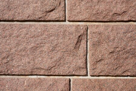 A vintage granite wall as a background. Copy space.
