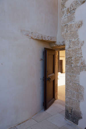 A open vintage door in old historical building.の写真素材