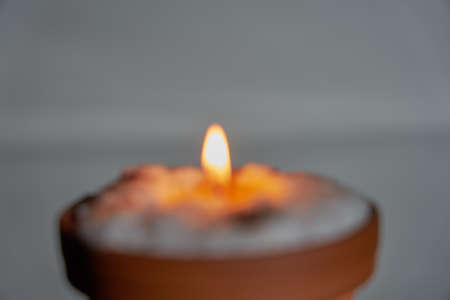 Blurred candle close up as a background.の写真素材