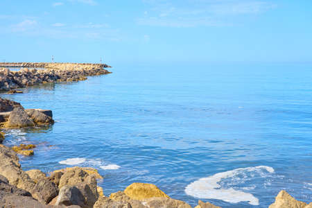 The stone coast of northern Crete on a sunny day. Holidays concept.
