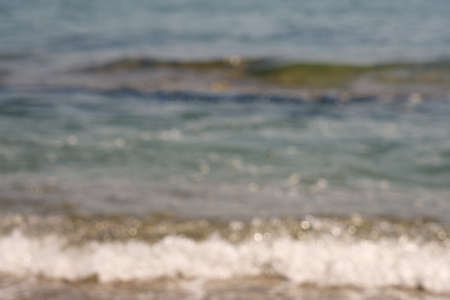 Blurred waves with foam on Aegean sea coast in Crete Greeceの写真素材