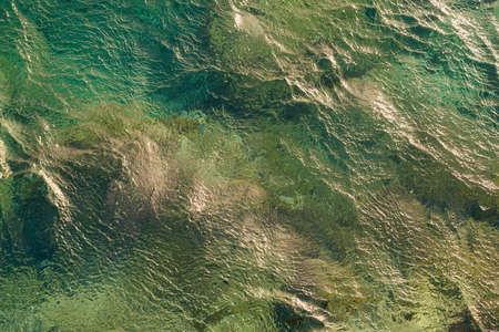 Waves on the surface of the turquoise tropical sea.の写真素材