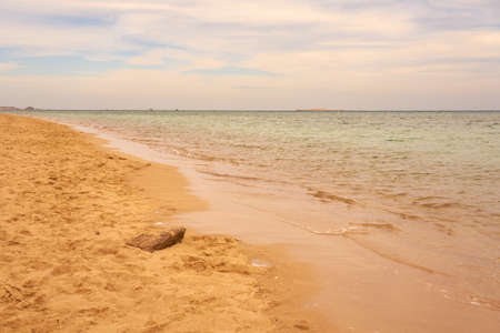 Waves on the tropical sandy beach of the red seaの写真素材