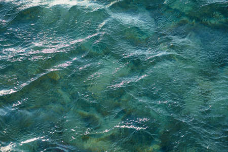 Waves on the surface of the turquoise tropical sea