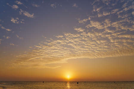 The sun rises over the Red Sea at dawnの写真素材