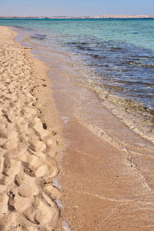 Waves on the tropical sandy beach of the red seaの写真素材