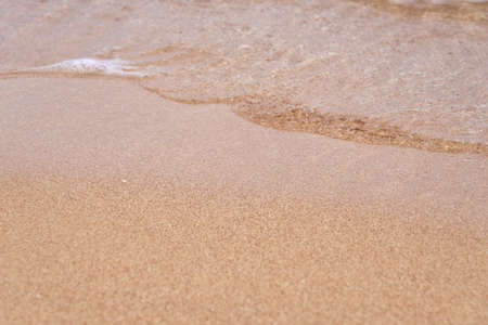 Waves on the tropical sandy beach of the red seaの写真素材