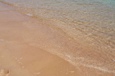 Waves on the tropical sandy beach of the red seaの写真素材