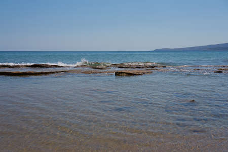 Waves on the stone coast of Creteの写真素材