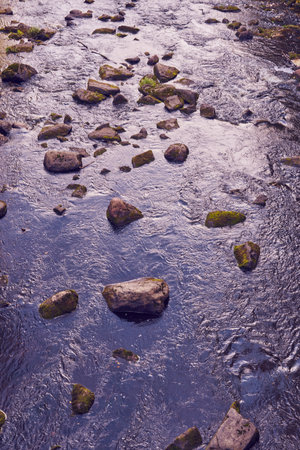 A fast mountain river in the mountains in autumn.