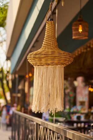 Lantern close up with a blurred cafe in the backgroundの写真素材