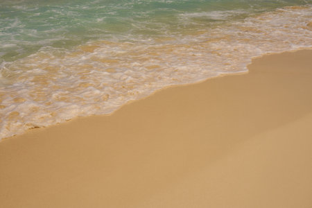 Waves with foam on the Caribbean coast in Mexico.の写真素材