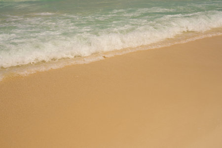 Waves with foam on the Caribbean coast in Mexico.の写真素材