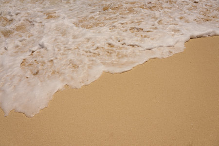 Waves with foam on the Caribbean coast in Mexico.の写真素材