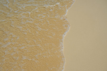Waves with foam on the Caribbean coast in Mexico.の写真素材