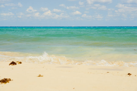 Waves with foam on the Caribbean coast in Mexicoの写真素材