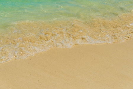 Waves with foam on the Caribbean coast in Mexico