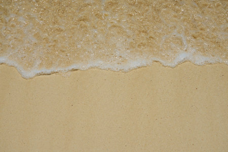 Waves with foam on the Caribbean coast in Mexicoの写真素材
