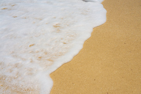 Waves with foam on the Caribbean coast in Mexicoの写真素材