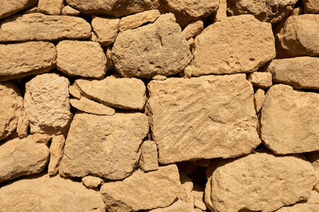 The wall is made of stones as a decorative backgroundの写真素材