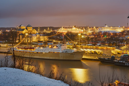The embankment of the Aura River in the city of Turku with the port and castle in the background.の写真素材