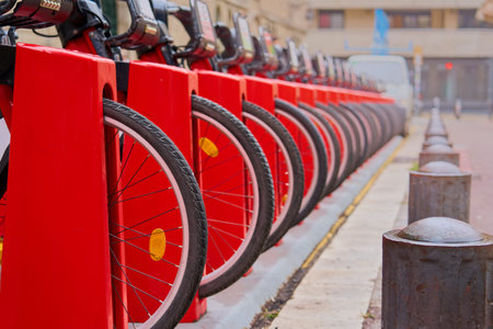 Bicycles for rent are parked on the street