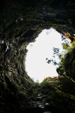 Cave called "Priest's Hole" and natural waterfallの写真素材