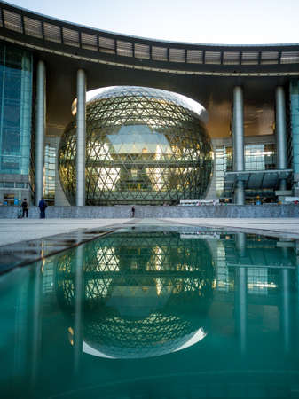 Shanghai, China - 11.11.2019: warm sunset light in Shanghai with modern residential skyscraper in downtown shanghai near the natural history museum sunsetのeditorial素材