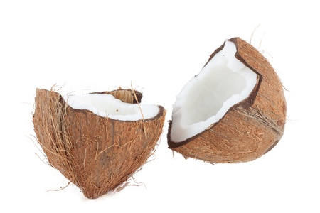 Two halves of coconut isolated on whiteの写真素材
