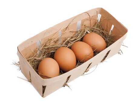Eggs in box isolated on whiteの写真素材