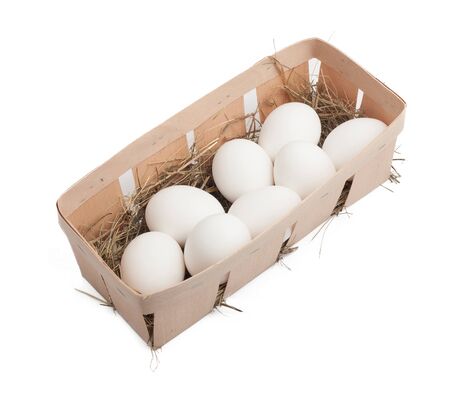 White eggs in box isolated on whiteの写真素材