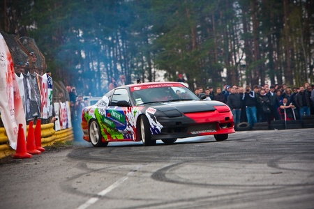 KIEV, Ukraine - April 24, 2010. The final stage of Ukrainian Championship Drift D1UDF. The driver of Nissan 200SX drifting on the track. Autodrome Chaika in Kiev.のeditorial素材