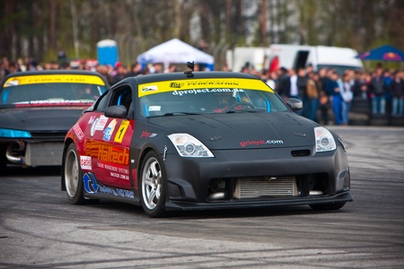 KIEV, Ukraine - April 24, 2010. The final stage of Ukrainian Championship Drift D1UDF. The driver Grinya (UKR) of black Nissan 350z drifting on the track. Autodrome Chaika in Kiev.のeditorial素材