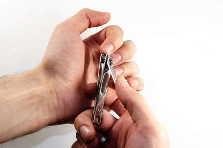 Cutting fingernails with forcepsの写真素材