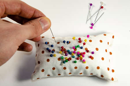 Needle invisible with colored ends in their handsの写真素材