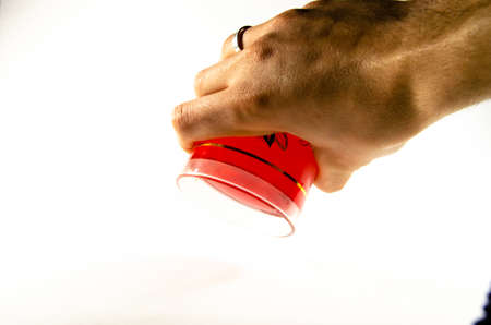 Bright red jelly in a glass on a light and dark background