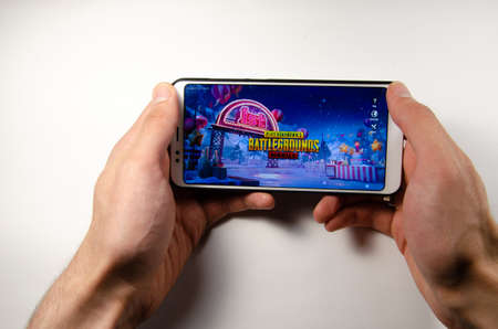 April, 2019. Kramatorsk, Ukraine. The gameplay of the game PUBG G Mobile on a white smartphone in...