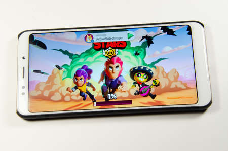 April, 2019. Kramatorsk, Ukraine. Brawl Stars gameplay on a white smartphone in handsのeditorial素材