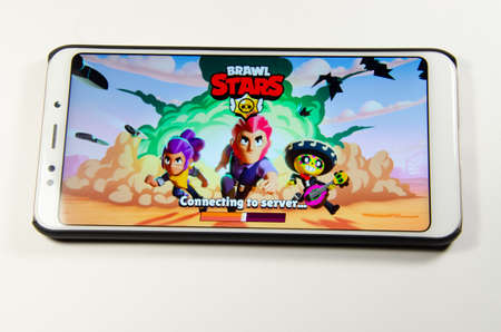 April, 2019. Kramatorsk, Ukraine. Brawl Stars gameplay on a white smartphone in handsのeditorial素材