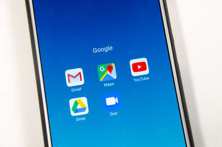 April, 2019. Kramatorsk, Ukraine. Mobile application Google Disk, Drive on a white smartphone in the handsのeditorial素材