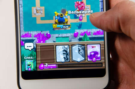 April, 2019. Kramatorsk, Ukraine. Clash Royale gameplay on a white smartphone in hand
