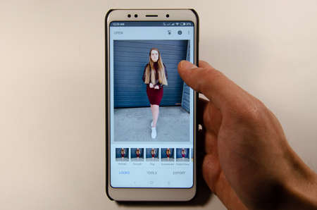 April, 2019. Kramatorsk, Ukraine. Snapseed mobile application on a white smartphone in handのeditorial素材