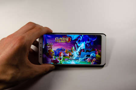 April, 2019. Kramatorsk, Ukraine. Clash of Clans gameplay on a white smartphone in hand