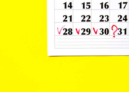 Checkmark on 28 29 30 numbers in the calendar on a yellow background. Mark on the calendar with a...