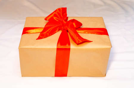 Boxes with gifts on a light, blue background and under the Christmas tree. Gift in the hand....