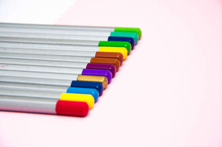 Top of the pencil. Multi-colored pencils in a row on the side and at an angle on a pink background. LGBTの写真素材