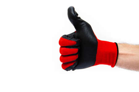 Gloves for workers, construction red with black rubber coating. Black-red gloves. Hand in gloves on a white background shows a thumbs up, likeの写真素材
