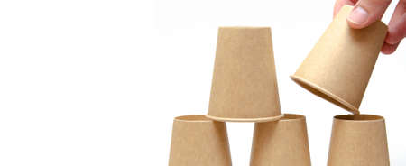Brown paper cup for coffee, tea, a drink from environmental materials on a white background. The...