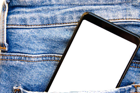 White screen smartphone in jeans pocket. Smartphone place for text. Smartphone in a pocket on a...